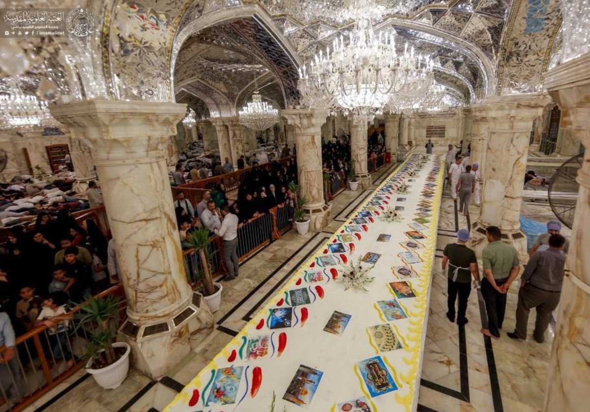 فیلم| توزیع بزرگ‌ترین کیک جهان در حرم امام علی