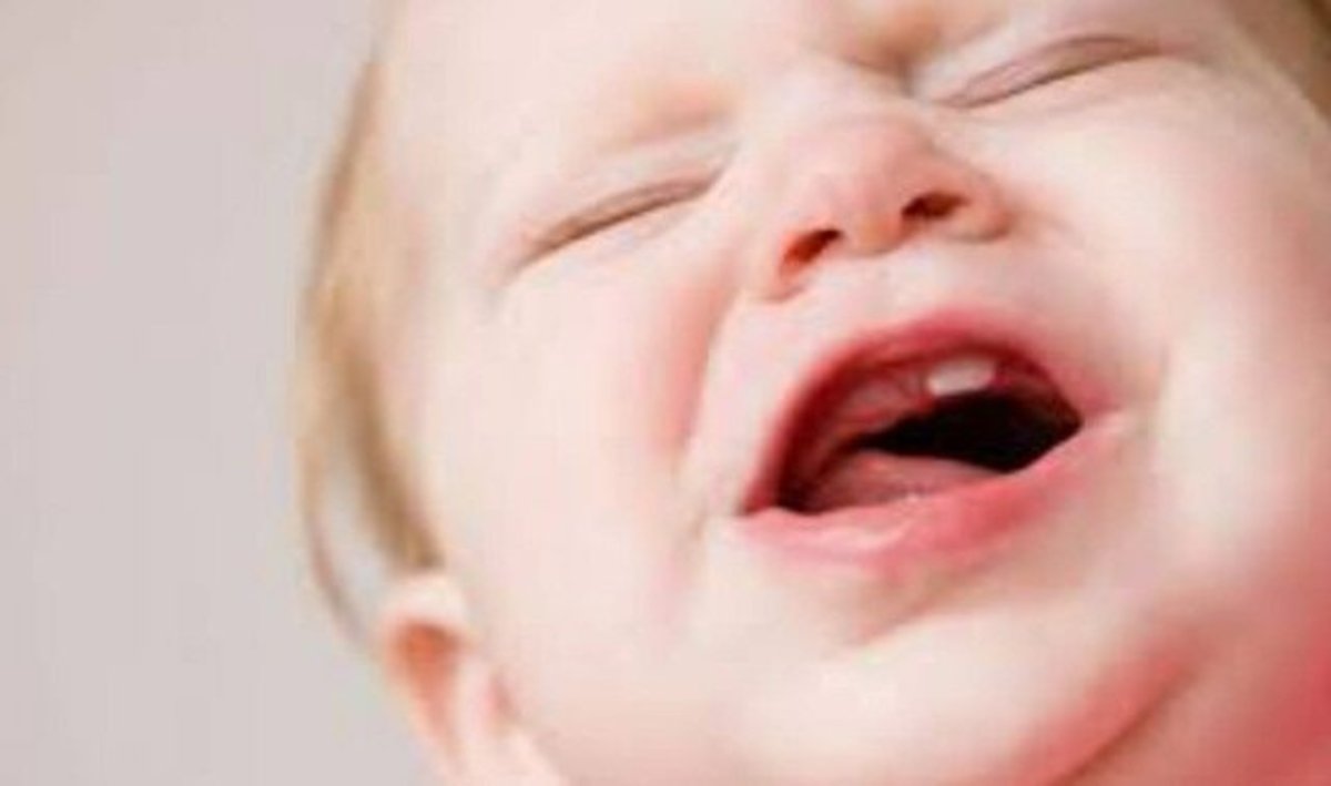 راه‌های کاهش درد رویش دندان در کودکان
