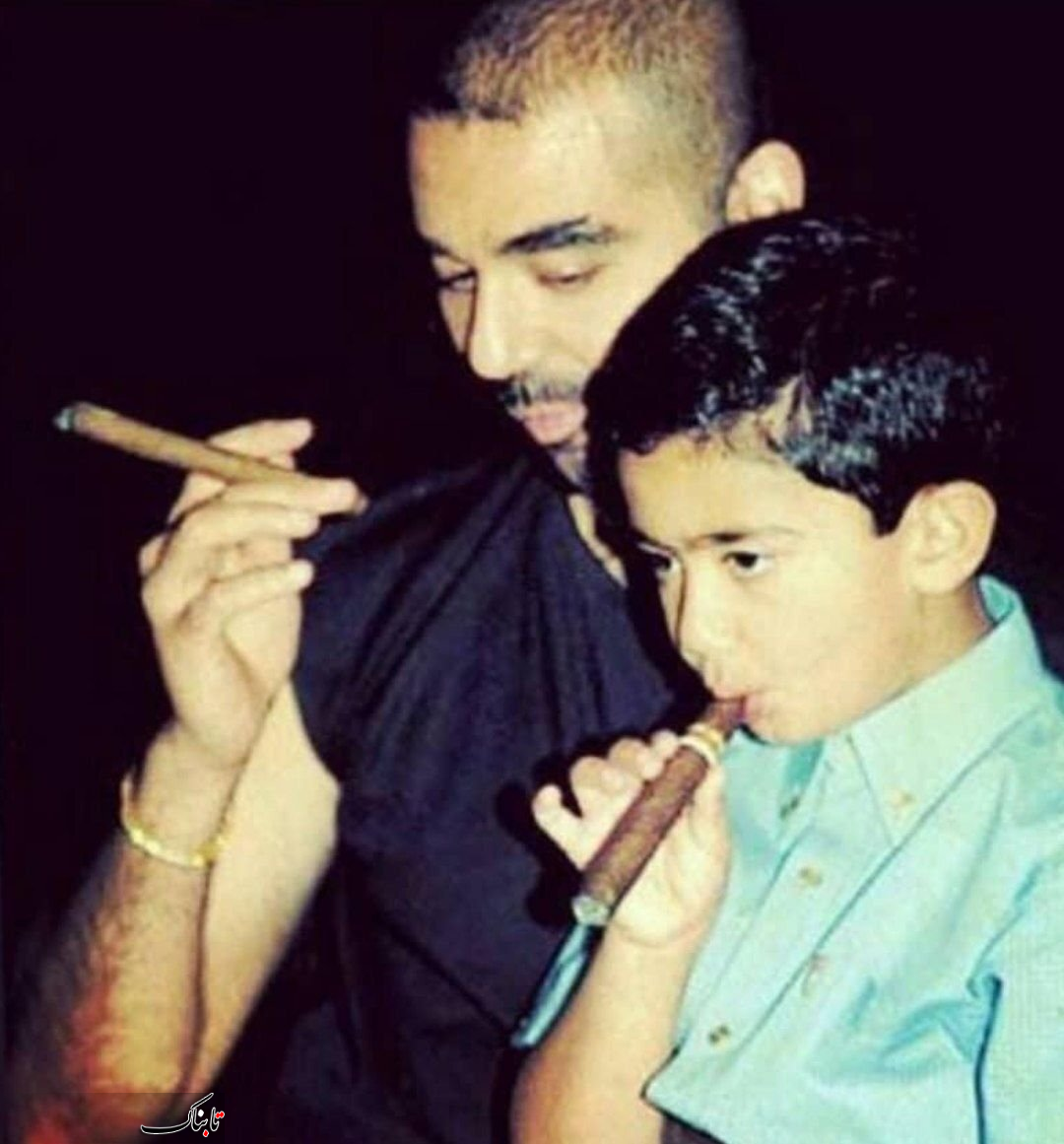 عکس/ سیگار کشیدن پسر صدام حسین و نوه اش